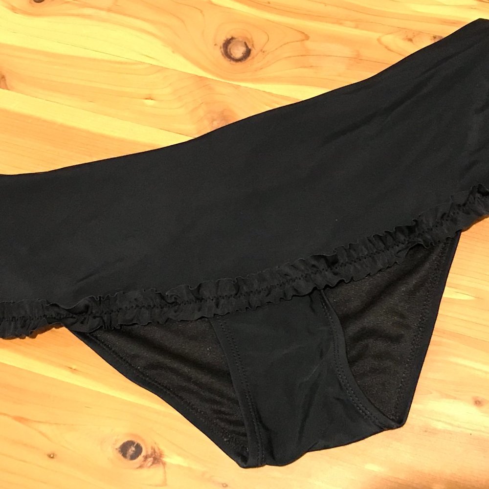 Want black swim suit bottom - frilly skirt detail, size medium